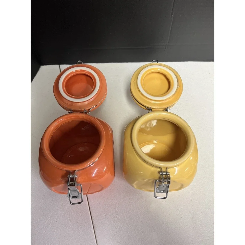 Set Of 2 Orange And Yellow Ceramic Jars With Locking Lids